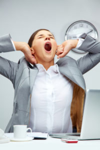 tired businesswoman stretching